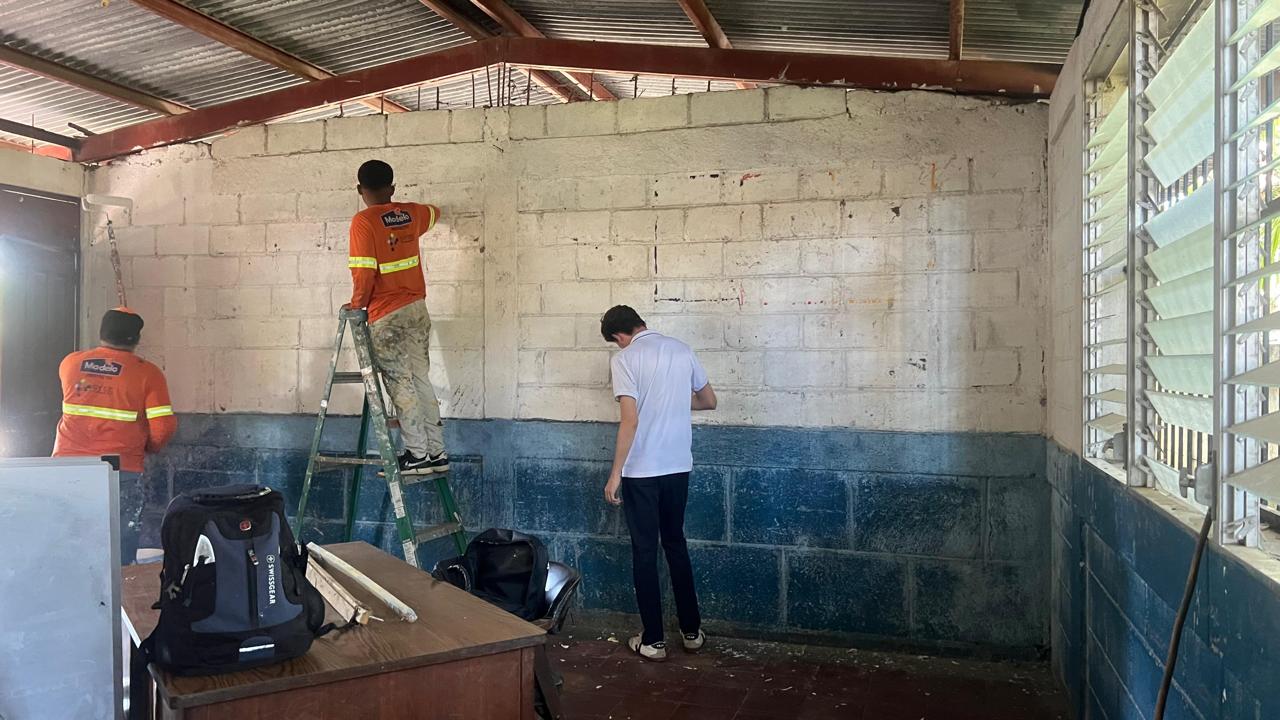 Painting behind-the-scenes work during the Engineers for Hope school transformation