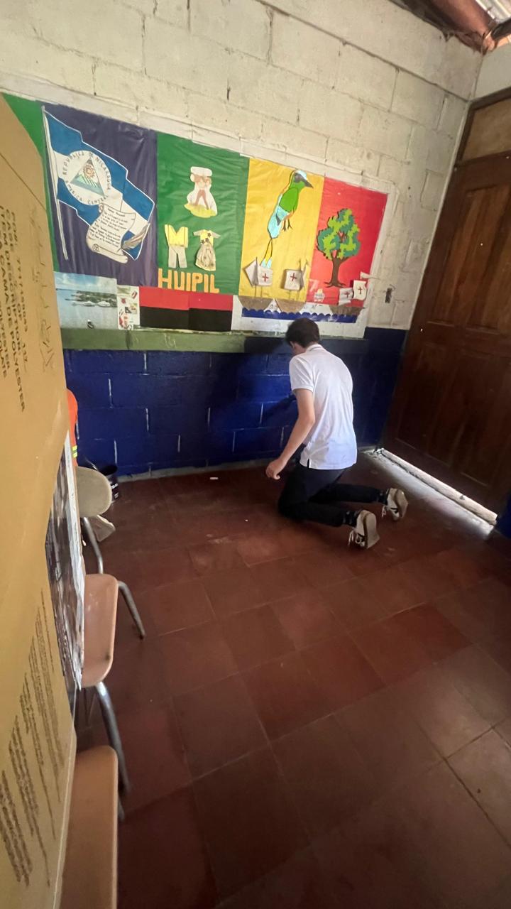Painting behind-the-scenes work during the Engineers for Hope school transformation