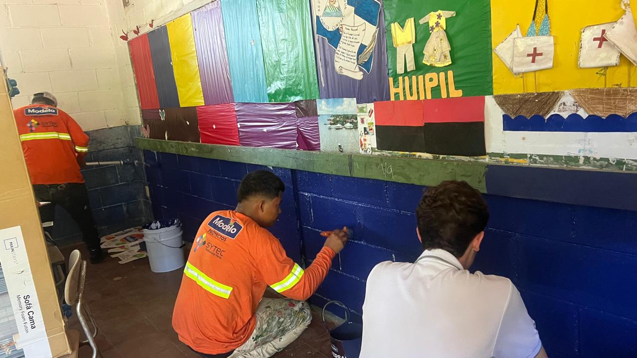 Painting behind-the-scenes work during the Engineers for Hope school transformation