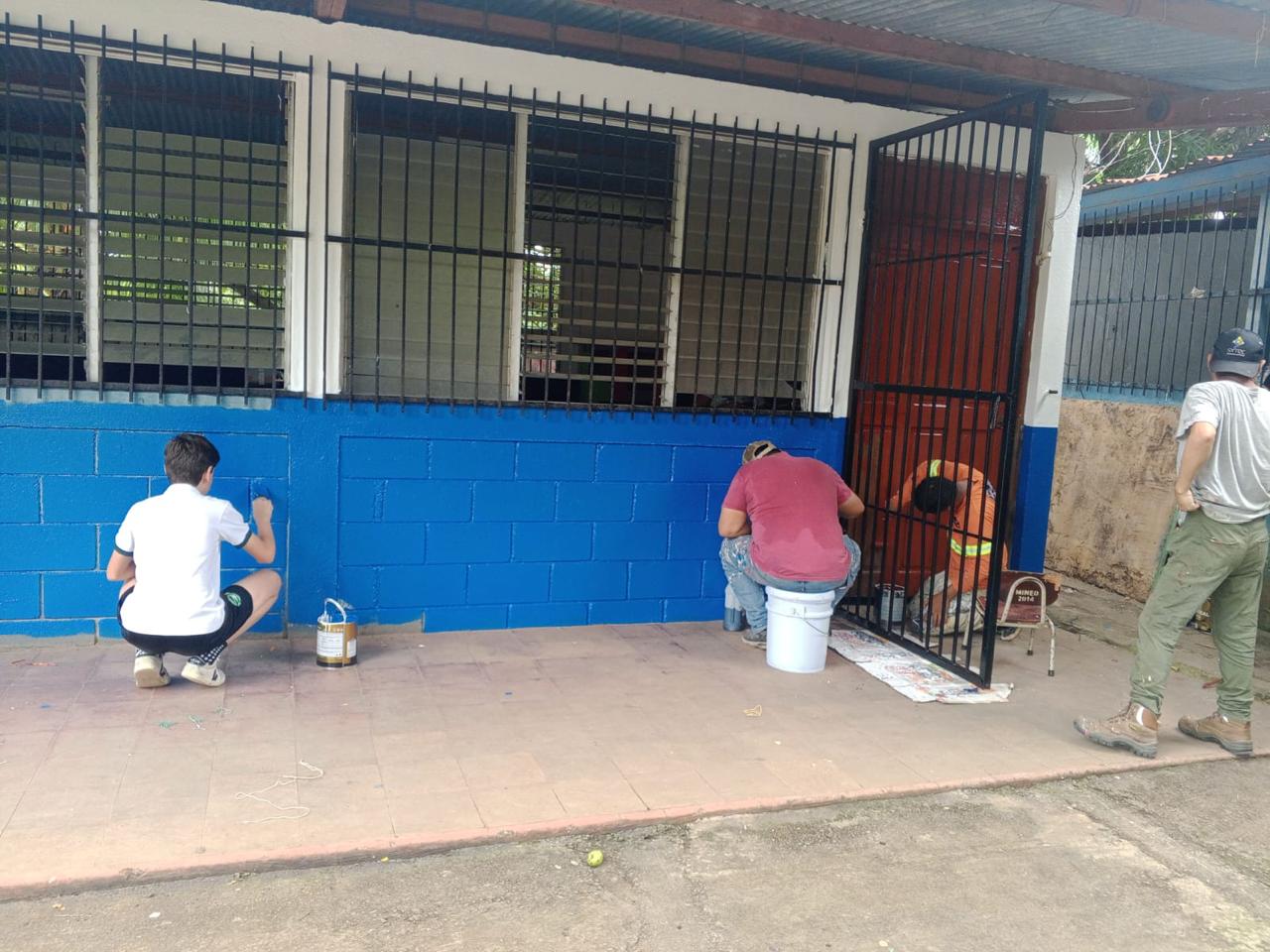 Painting behind-the-scenes work during the Engineers for Hope school transformation